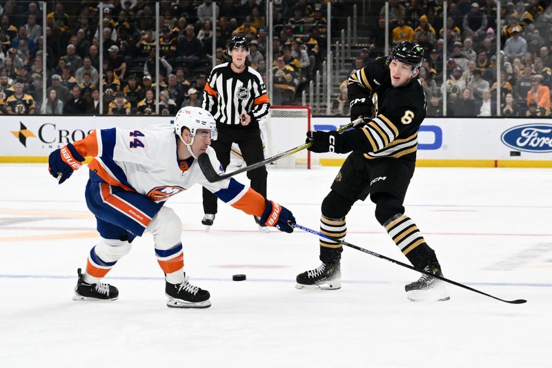 Nov 9, 2023; Boston, Massachusetts, USA; Boston Bruins defenseman Mason Lohrei (6) attempts a shot against New York Islanders center Jean-Gabriel Pageau (44) during the first period at the TD Garden. Mandatory Credit: Brian Fluharty-USA TODAY Sports