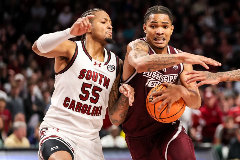 Jan 6, 2024; Columbia, South Carolina, USA; Mississippi State Bulldogs guard Shakeel Moore (3) drives around South Carolina Gamecocks guard Ta'Lon Cooper (55) in the second half at Colonial Life Arena. Mandatory Credit: Jeff Blake-USA TODAY Sports