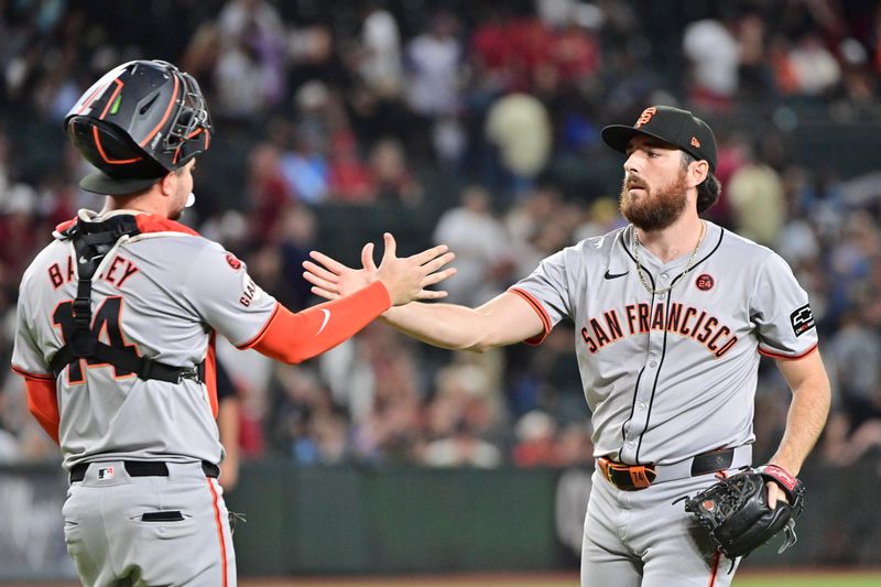 Sep 23, 2024; Phoenix, Arizona, USA;  San Francisco Giants pitcher Ryan Walker (74) celebrates with catcher Patrick Bailey (14) after defeating the Arizona Diamondbacks at Chase Field. Mandatory Credit: Matt Kartozian-Imagn Images