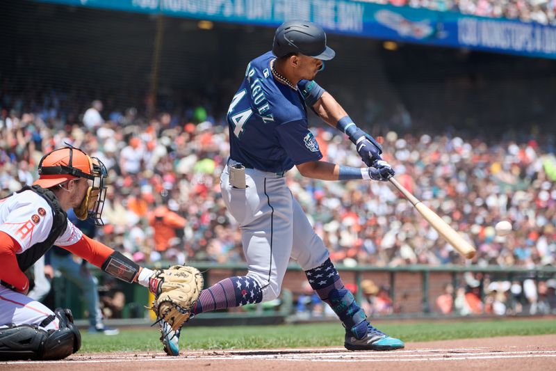 Jul 4, 2023; San Francisco, California, USA; Seattle Mariners outfielder Julio Rodriguez (44) hits a single against the San Francisco Giants during the first inning at Oracle Park. Mandatory Credit: Robert Edwards-USA TODAY Sports