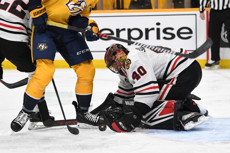 Jan 2, 2024; Nashville, Tennessee, USA; Chicago Blackhawks goaltender Arvid Soderblom (40) makes a save during the first period against the Nashville Predators at Bridgestone Arena. Mandatory Credit: Christopher Hanewinckel-USA TODAY Sports