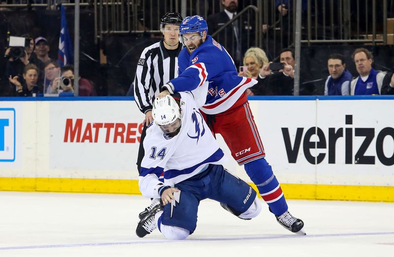 Apr 5, 2023; New York, New York, USA; New York Rangers defenseman Ben Harpur (5) fights Tampa Bay Lightning left wing Pat Maroon (14) during the first period at Madison Square Garden. Mandatory Credit: Danny Wild-USA TODAY Sports