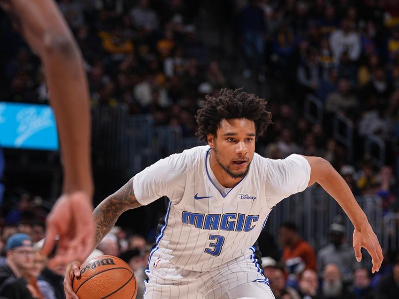 DENVER, CO - JANUARY 5: Chuma Okeke #3 of the Orlando Magic drives to the basket during the game against the Denver Nuggets on January 5, 2024 at the Ball Arena in Denver, Colorado. NOTE TO USER: User expressly acknowledges and agrees that, by downloading and/or using this Photograph, user is consenting to the terms and conditions of the Getty Images License Agreement. Mandatory Copyright Notice: Copyright 2024 NBAE (Photo by Bart Young/NBAE via Getty Images)