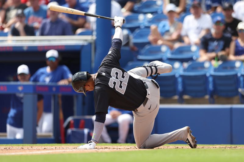 Mar 8, 2024; Dunedin, Florida, USA;  New York Yankees right fielder Juan Soto (22) trips up during a swing against the Toronto Blue Jays in the third inning at TD Ballpark. Mandatory Credit: Nathan Ray Seebeck-USA TODAY Sports