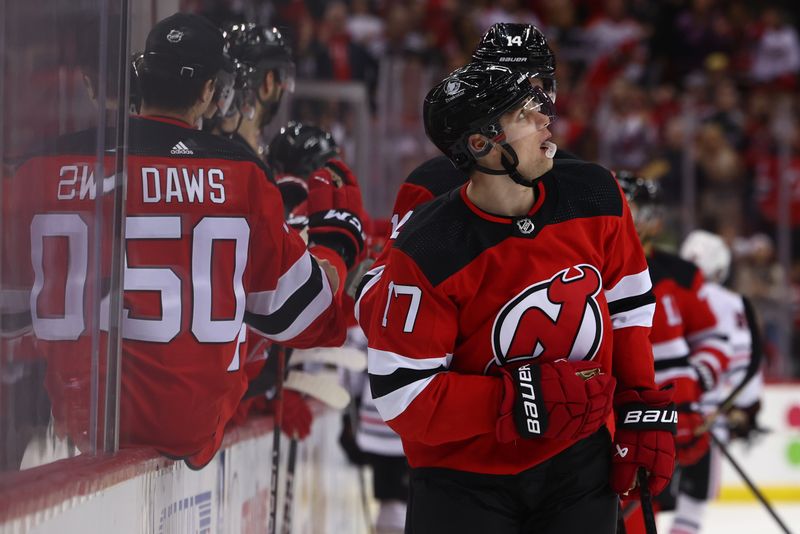 Jan 5, 2024; Newark, New Jersey, USA; New Jersey Devils defenseman Simon Nemec (17) celebrates his goal against the Chicago Blackhawks during the third period at Prudential Center. Mandatory Credit: Ed Mulholland-USA TODAY Sports