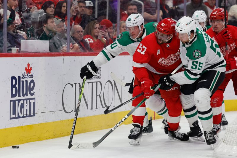 Jan 23, 2024; Detroit, Michigan, USA;  Dallas Stars defenseman Ryan Suter (20) Detroit Red Wings left wing David Perron (57) and defenseman Thomas Harley (55) battle for the puck in the second period at Little Caesars Arena. Mandatory Credit: Rick Osentoski-USA TODAY Sports