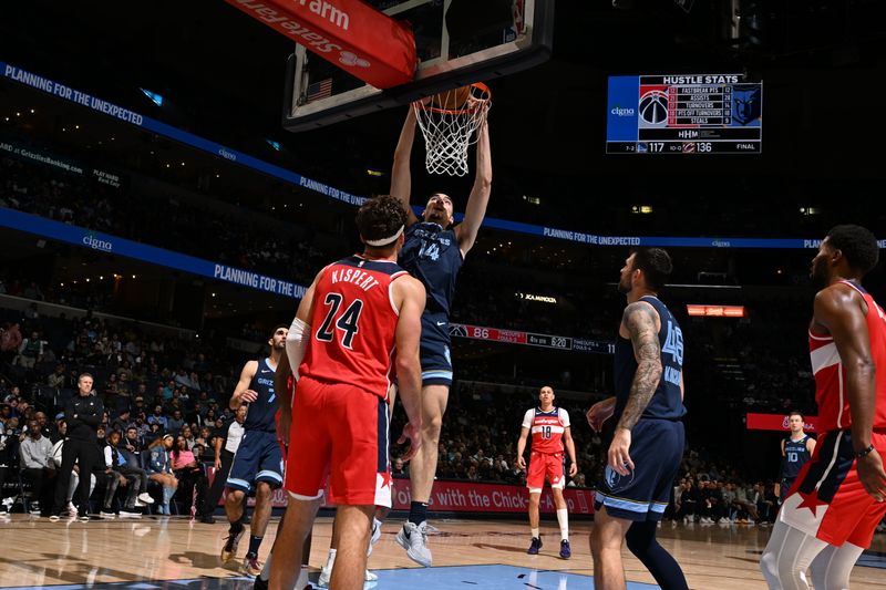 MEMPHIS, TN - NOVEMBER 8: Zach Edey #14 of the Memphis Grizzlies dunks the ball during the game against the Washington Wizards on November 8, 2024 at FedExForum in Memphis, Tennessee. NOTE TO USER: User expressly acknowledges and agrees that, by downloading and or using this photograph, User is consenting to the terms and conditions of the Getty Images License Agreement. Mandatory Copyright Notice: Copyright 2024 NBAE (Photo by Grant Burke/NBAE via Getty Images)