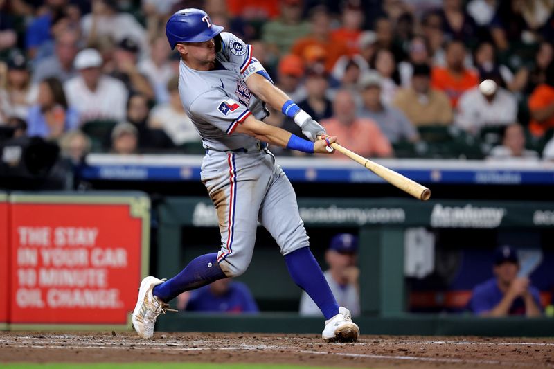 Sep 15, 2025; Houston, Texas, USA; Texas Rangers third baseman Josh Jung (6) hits a two run home run to left field against the Houston Astros during the fifth inning at Daikin Park. Mandatory Credit: Erik Williams-Imagn Images