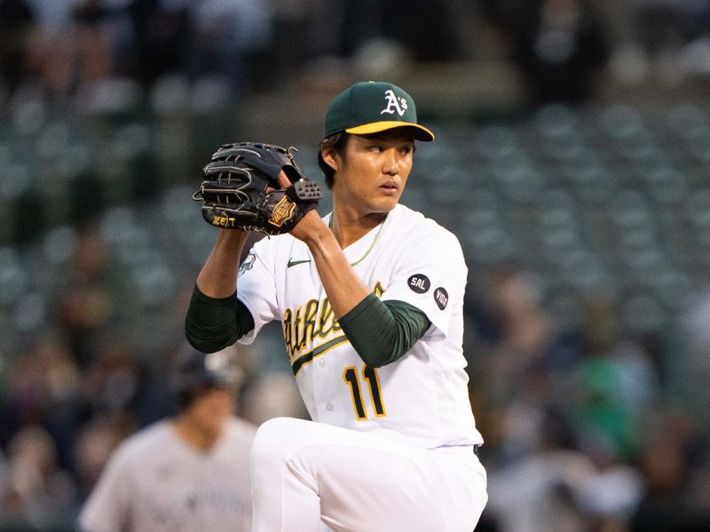 Jun 28, 2023; Oakland, California, USA;  Oakland Athletics relief pitcher Shintaro Fujinami (11) pitches during the fifth inning against the New York Yankees at Oakland-Alameda County Coliseum. Mandatory Credit: Stan Szeto-USA TODAY Sports