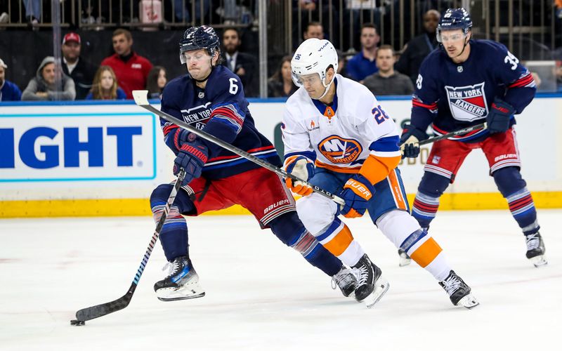 Nov 3, 2024; New York, New York, USA; New York Rangers defenseman Zac Jones (6) and New York Islanders right wing Oliver Wahlstrom (26) battle for the puck during the second period at Madison Square Garden. Mandatory Credit: Danny Wild-Imagn Images