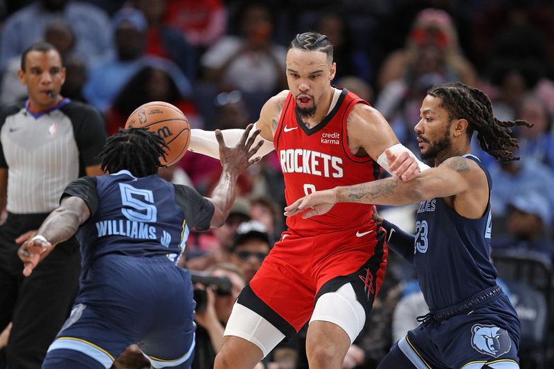 MEMPHIS, TENNESSEE - FEBRUARY 14: Dillon Brooks #9 of the Houston Rockets handles the ball against Derrick Rose #23 and Vince Williams Jr. #5 of the Memphis Grizzlies during the second half at FedExForum on February 14, 2024 in Memphis, Tennessee. NOTE TO USER: User expressly acknowledges and agrees that, by downloading and or using this photograph, User is consenting to the terms and conditions of the Getty Images License Agreement. (Photo by Justin Ford/Getty Images)
