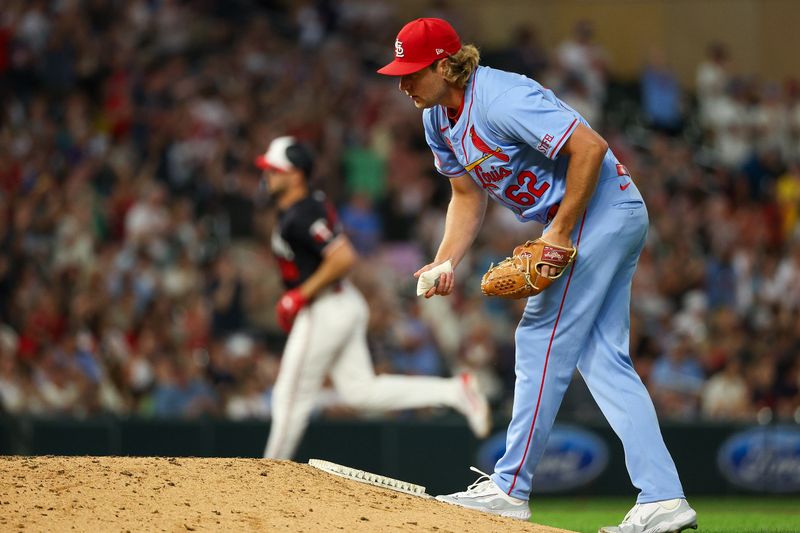 Aug 24, 2024; Minneapolis, Minnesota, USA; St. Louis Cardinals pitcher Kyle Leahy (62) reacts after giving up a solo home run to Minnesota Twins designated hitter Matt Wallner (38) during the eighth inning at Target Field. Mandatory Credit: Matt Krohn-USA TODAY Sports