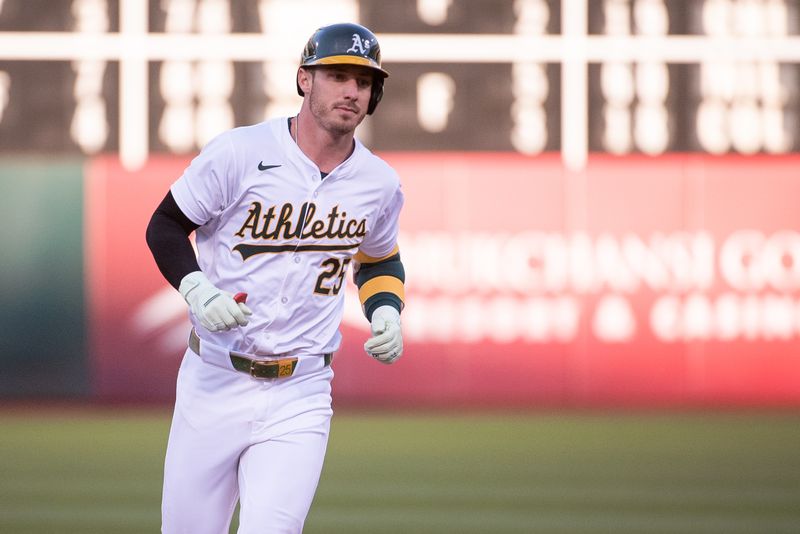 Jul 2, 2024; Oakland, California, USA; Oakland Athletics outfielder Brent Rooker (25) rounds the bases after hitting a home run against the Los Angeles Angels during the fourth inning at Oakland-Alameda County Coliseum. Mandatory Credit: Ed Szczepanski-USA TODAY Sports