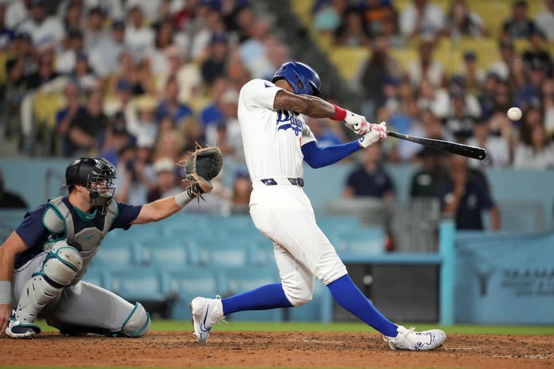 Aug 20, 2024; Los Angeles, California, USA;  Los Angeles Dodgers right fielder Jason Heyward (23) hits a three-run home run in the eighth inning as Seattle Mariners catcher Cal Raleigh (29) watches at Dodger Stadium. Mandatory Credit: Kirby Lee-USA TODAY Sports