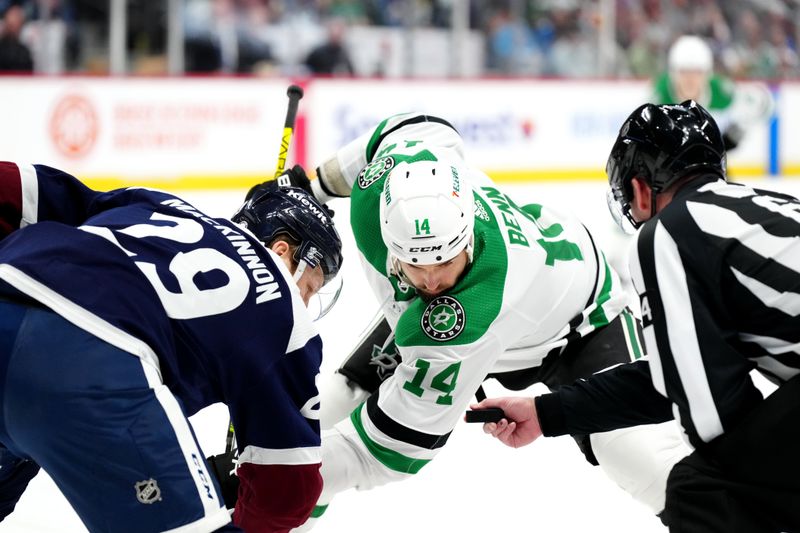 Apr 7, 2024; Denver, Colorado, USA; Dallas Stars left wing Jamie Benn (14) and Colorado Avalanche center Nathan MacKinnon (29) await the drop of the puck from referee Francis Charron (6) in the first period at Ball Arena. Mandatory Credit: Ron Chenoy-USA TODAY Sports