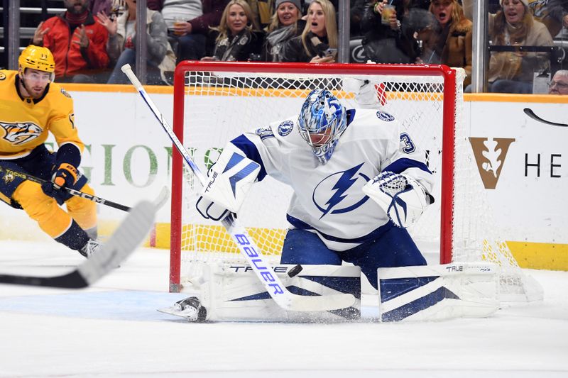 Dec 3, 2023; Nashville, Tennessee, USA; Tampa Bay Lightning goaltender Jonas Johansson (31) makes a save during the first period against the Nashville Predators at Bridgestone Arena. Mandatory Credit: Christopher Hanewinckel-USA TODAY Sports