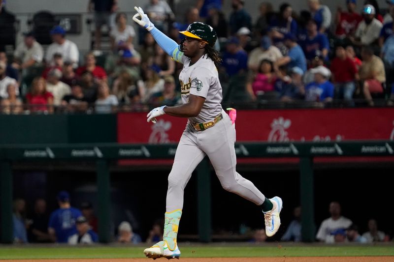 Aug 31, 2024; Arlington, Texas, USA; Oakland Athletics right fielder Lawrence Butler (4) reacts as he rounds the bases after hitting a solo home run during the fourth inning against the Texas Rangers at Globe Life Field. Mandatory Credit: Raymond Carlin III-USA TODAY Sports