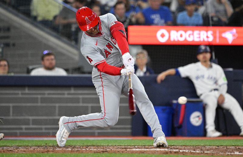 Aug 22, 2024; Toronto, Ontario, CAN;  Los Angeles Angels left fielder Taylor Ward (3) hits a single against the Toronto Blue Jays in the fifth inning at Rogers Centre. Mandatory Credit: Dan Hamilton-USA TODAY Sports