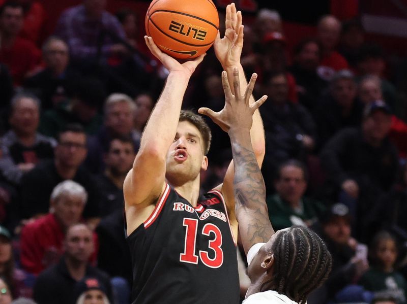 Jan 27, 2026; Piscataway, New Jersey, USA;  Rutgers Scarlet Knights guard Harun Zrno (13) shoots the ball against the Rutgers Scarlet Knights Michigan State Spartans forward Jordan Scott (6) during the second half at Jersey Mike's Arena. Mandatory Credit: Vincent Carchietta-Imagn Images