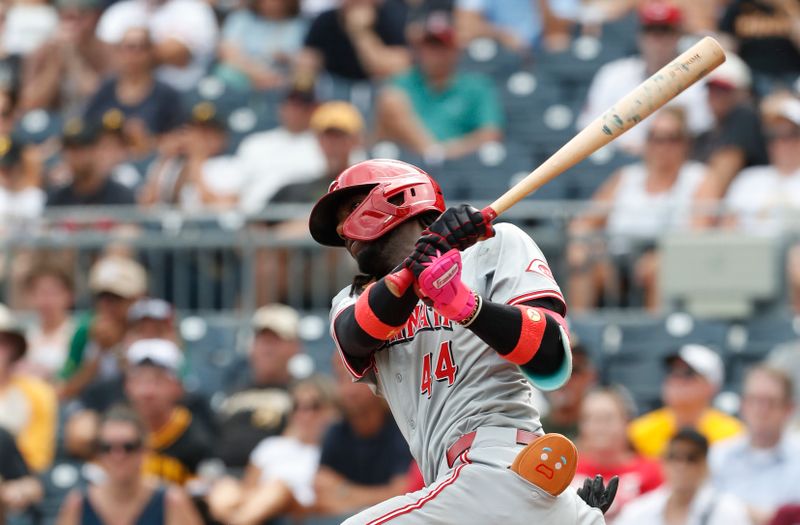 Aug 25, 2024; Pittsburgh, Pennsylvania, USA;  Cincinnati Reds shortstop Elly De La Cruz (44) hits a single against the Pittsburgh Pirates during the ninth inning at PNC Park. Mandatory Credit: Charles LeClaire-USA TODAY Sports