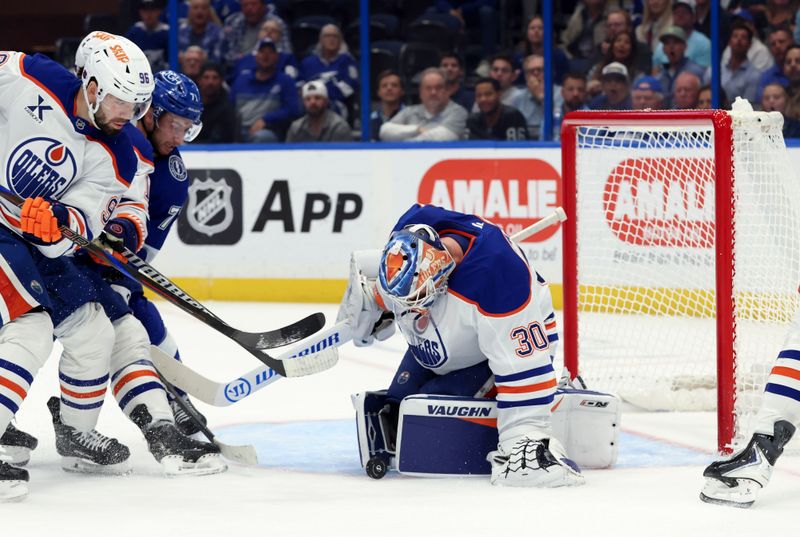 Nov 20, 2025; Tampa, Florida, USA;  Edmonton Oilers goaltender Calvin Pickard (30)  makes a save against the Tampa Bay Lightning during the first period at Benchmark International Arena. Mandatory Credit: Kim Klement Neitzel-Imagn Images