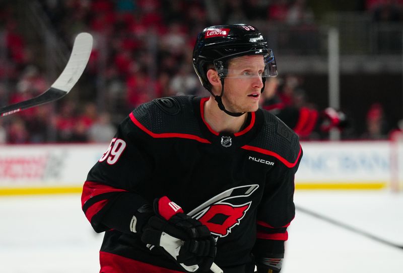 Mar 14, 2024; Raleigh, North Carolina, USA; Carolina Hurricanes left wing Jake Guentzel (59) skates against the Florida Panthers during the third period at PNC Arena. Mandatory Credit: James Guillory-USA TODAY Sports