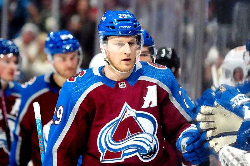 Apr 18, 2024; Denver, Colorado, USA; Colorado Avalanche center Nathan MacKinnon (29) celebrates his second assistant of a goal in the first period against the Edmonton Oilers at Ball Arena. Mandatory Credit: Ron Chenoy-USA TODAY Sports