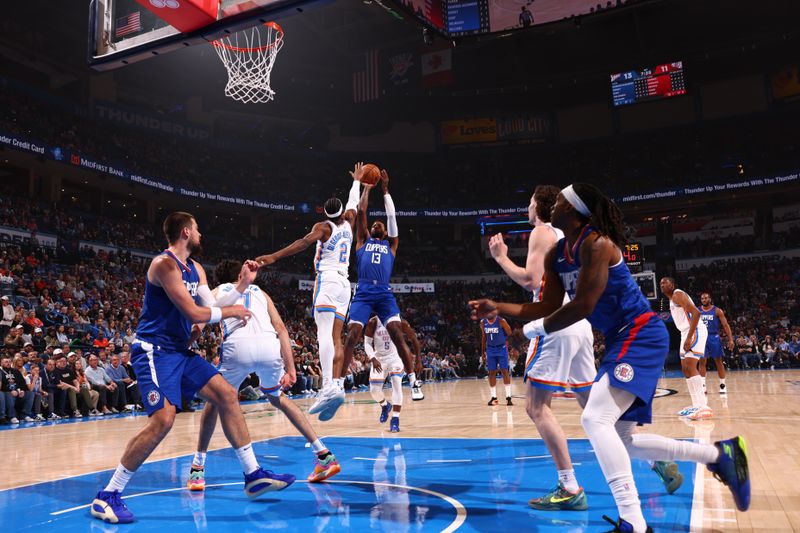 OKLAHOMA CITY, OK - FEBRUARY 22:  Paul George #13 of the LA Clippers drives to the basket during the game against the Oklahoma City Thunder on February 22SF, 2024 at Paycom Arena in Oklahoma City, Oklahoma. NOTE TO USER: User expressly acknowledges and agrees that, by downloading and or using this photograph, User is consenting to the terms and conditions of the Getty Images License Agreement. Mandatory Copyright Notice: Copyright 2024 NBAE (Photo by Zach Beeker/NBAE via Getty Images)