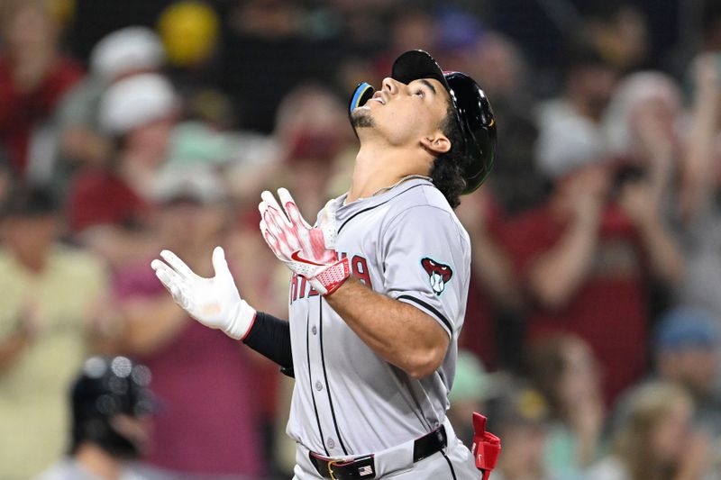 July 5, 2024; San Diego, California, USA; Arizona Diamondbacks center fielder Alek Thomas (5) looks skyward after hitting a grand slam during the ninth inning against the San Diego Padres at Petco Park. Mandatory Credit: Denis Poroy-USA TODAY Sports