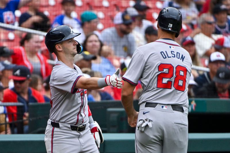 Jun 26, 2024; St. Louis, Missouri, USA;  Atlanta Braves first baseman Matt Olson (28) is congratulated by shortstop Zack Short (59) after scoring against the St. Louis Cardinals during the second inning at Busch Stadium. Mandatory Credit: Jeff Curry-USA TODAY Sports