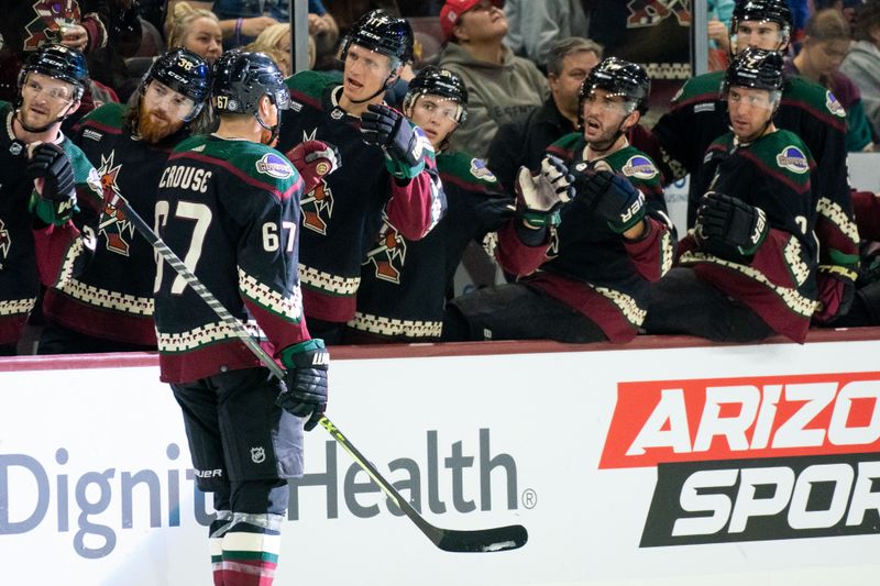 Oct 30, 2022; Tempe, Arizona, USA; Arizona Coyotes forwards Lawson Crouse (67) celebrates with his team after scoring against the New York Rangers in the second period at Mullett Arena. The Rangers beat the Coyotes 3-2. Mandatory Credit: Allan Henry-USA TODAY Sports