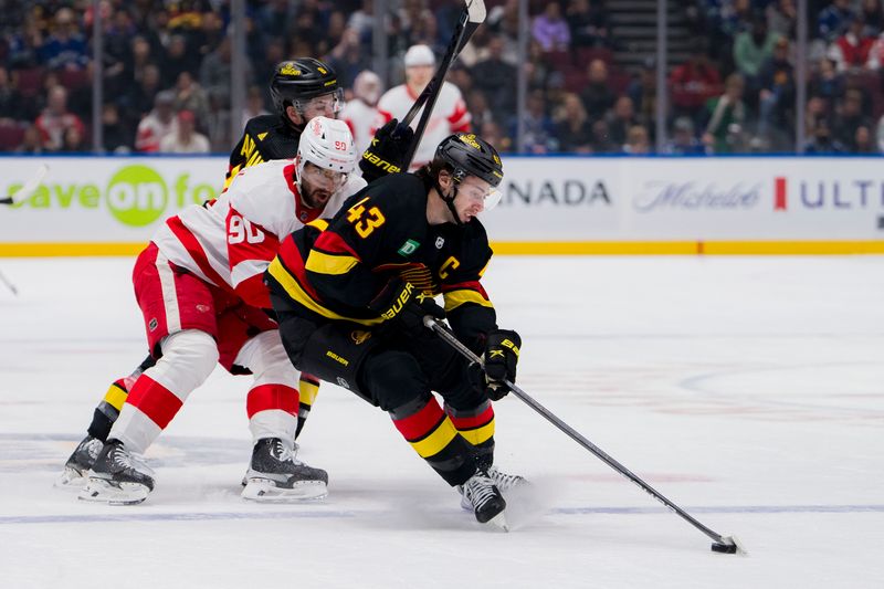 Feb 15, 2024; Vancouver, British Columbia, CAN; Vancouver Canucks defenseman Quinn Hughes (43) handles the puck as Detroit Red Wings forward Joe Veleno (90) battles with forward Conor Garland (8) in the first period at Rogers Arena. Mandatory Credit: Bob Frid-USA TODAY Sports