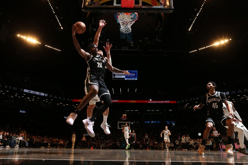 BROOKLYN, NY - DECEMBER 8: Day'Ron Sharpe #20 of the Brooklyn Nets shoots the ball during the game against the Milwaukee Bucks on December 8, 2024 at Barclays Center in Brooklyn, New York. NOTE TO USER: User expressly acknowledges and agrees that, by downloading and or using this Photograph, user is consenting to the terms and conditions of the Getty Images License Agreement. Mandatory Copyright Notice: Copyright 2024 NBAE (Photo by Nathaniel S. Butler/NBAE via Getty Images)