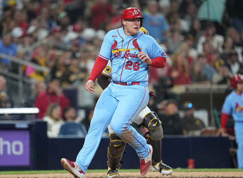 Sep 23, 2023; San Diego, California, USA; St. Louis Cardinals designated hitter Luken Baker (26) scores on an RBI single by shortstop Masyn Winn (no pictured) against the San Diego Padres during the seventh inning at Petco Park. Mandatory Credit: Ray Acevedo-USA TODAY Sports