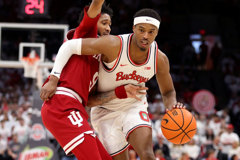 Jan 17, 2025; Columbus, Ohio, USA; Ohio State Buckeyes guard Micah Parrish (8) drives to the basket as Indiana Hoosiers guard Kanaan Carlyle (9) defends during the second half at Value City Arena. Mandatory Credit: Joseph Maiorana-Imagn Images