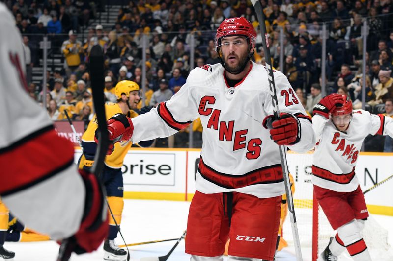 Dec 27, 2023; Nashville, Tennessee, USA; Carolina Hurricanes right wing Stefan Noesen (23) celebrates after scoring during the second period against the Nashville Predators at Bridgestone Arena. Mandatory Credit: Christopher Hanewinckel-USA TODAY Sports