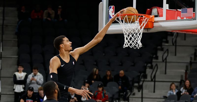 SAN ANTONIO, TX - DECEMBER 26:   Victor Wembanyama #1 of the San Antonio Spurs takes warm up shots before their game against the Utah Jazz at Frost Bank Center on December  26, 2023 in San Antonio, Texas. NOTE TO USER: User expressly acknowledges and agrees that, by downloading and or using this photograph, User is consenting to terms and conditions of the Getty Images License Agreement. (Photo by Ronald Cortes/Getty Images)