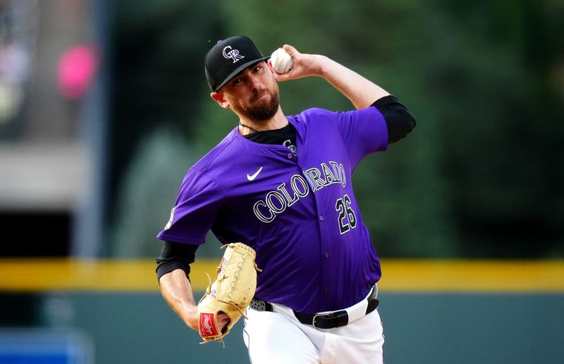 Jul 1, 2024; Denver, Colorado, USA; Colorado Rockies starting pitcher Austin Gomber (26) delivers a pitch in the first inning against the Milwaukee Brewers at Coors Field. Mandatory Credit: Ron Chenoy-USA TODAY Sports