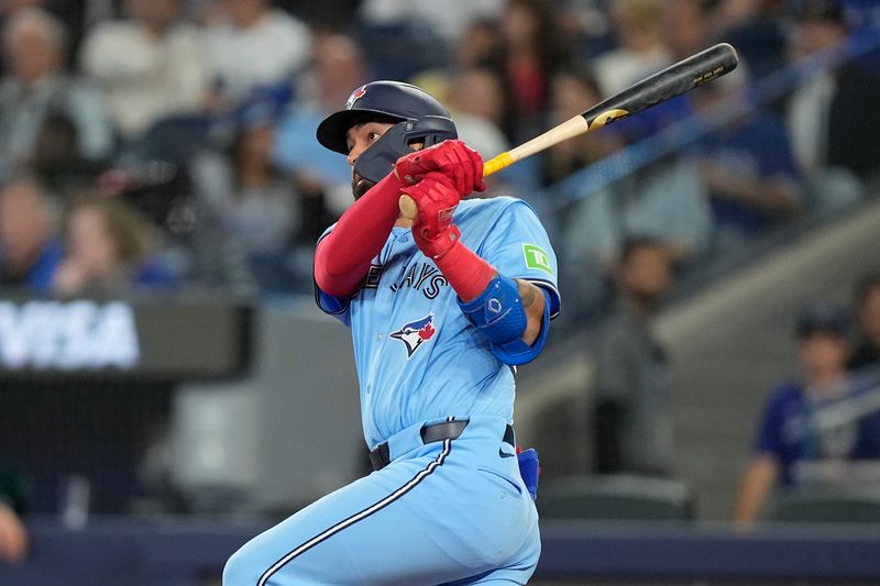May 29, 2025; Toronto, Ontario, CAN; Toronto Blue Jays first baseman Ali Sanchez (20) hits a double against the Athletics during the seventh inning at Rogers Centre. Mandatory Credit: John E. Sokolowski-Imagn Images