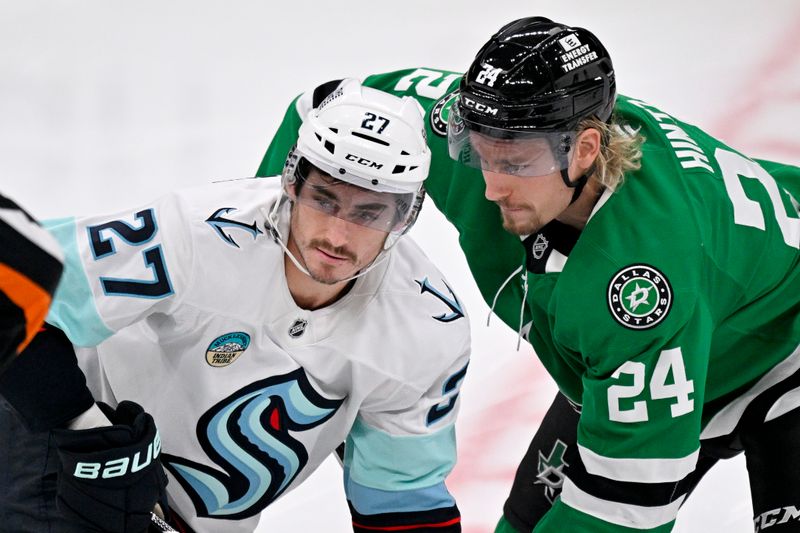 Nov 9, 2025; Dallas, Texas, USA; Seattle Kraken left wing Mason Marchment (27) and Dallas Stars center Roope Hintz (24) take the opening face-off during the first period at the American Airlines Center. Mandatory Credit: Jerome Miron-Imagn Images