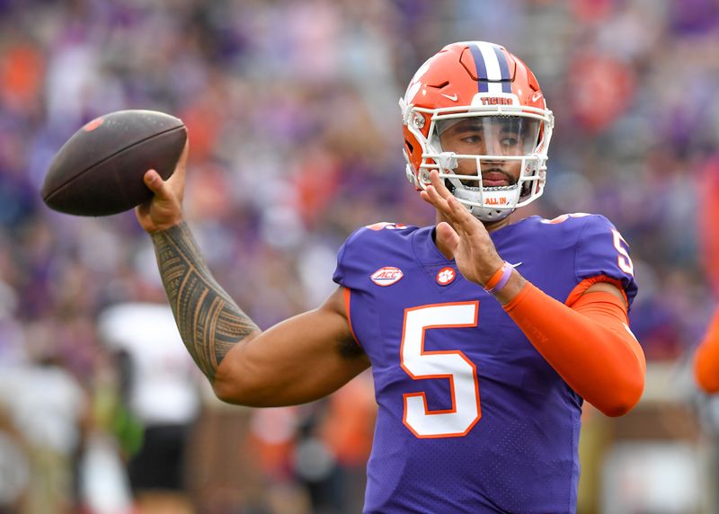 Nov 12, 2022; Clemson, South Carolina, USA; Nov 12, 2022; Clemson, South Carolina, USA; Clemson quarterback D.J. Uiagalelei (5) warms up passing before the game with Louisville at Memorial Stadium in Clemson, South Carolina Saturday, Nov. 12, 2022.     Mandatory Credit: Ken Ruinard-USA TODAY Sports Mandatory Credit: Ken Ruinard-USA TODAY Sports