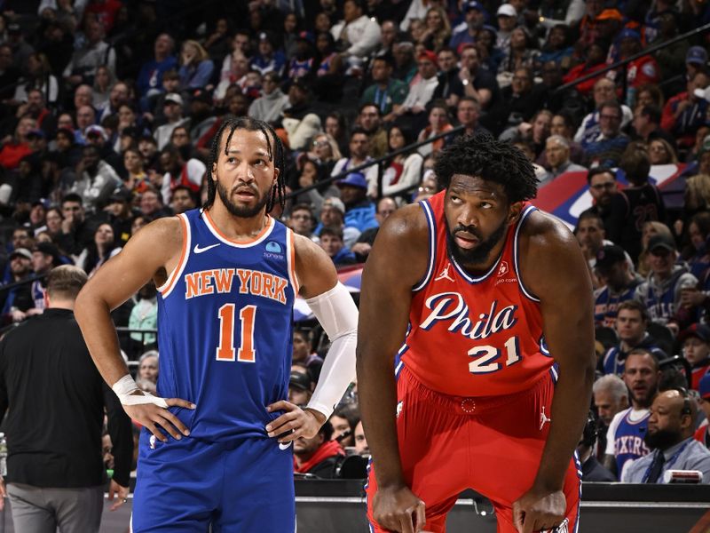 PHILADELPHIA, PA - JANUARY 5:  Jalen Brunson #11 of the New York Knicks and Joel Embiid #21 of the Philadelphia 76ers look on during the game on January 5, 2024 at the Wells Fargo Center in Philadelphia, Pennsylvania NOTE TO USER: User expressly acknowledges and agrees that, by downloading and/or using this Photograph, user is consenting to the terms and conditions of the Getty Images License Agreement. Mandatory Copyright Notice: Copyright 2024 NBAE (Photo by David Dow/NBAE via Getty Images)