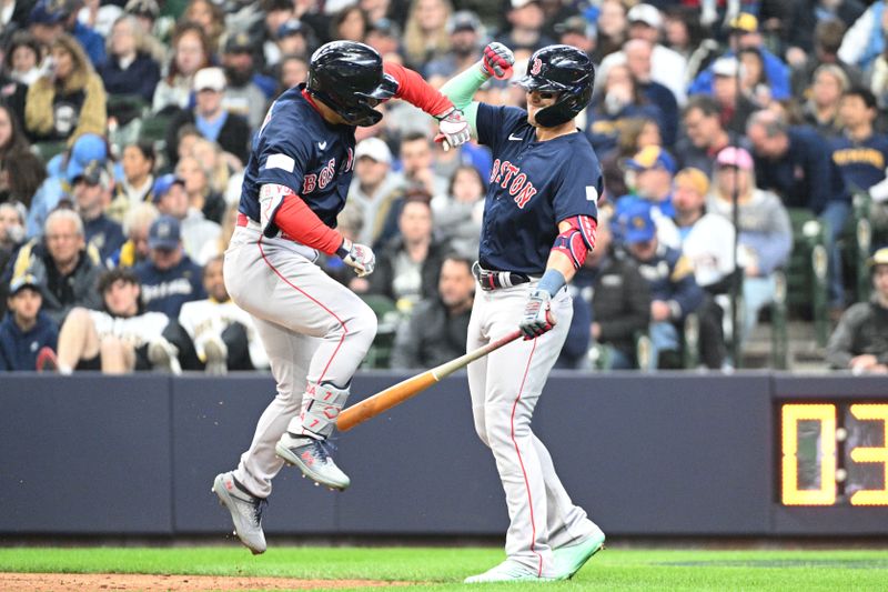 Apr 23, 2023; Milwaukee, Wisconsin, USA; Boston Red Sox left fielder Masataka Yoshida (7) celebrates with Boston Red Sox shortstop Enrique Hernandez (5) after hitting a home run against the Milwaukee Brewers at American Family Field. Mandatory Credit: Michael McLoone-USA TODAY Sports