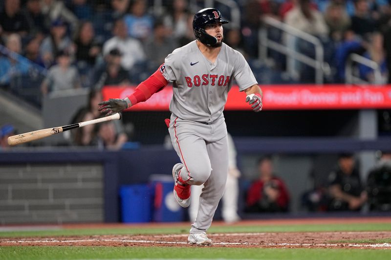 Apr 29, 2025; Toronto, Ontario, CAN; Boston Red Sox right fielder Wilyer Abreu (52) hits a single against the Toronto Blue Jays during the ninth inning at Rogers Centre. Mandatory Credit: John E. Sokolowski-Imagn Images