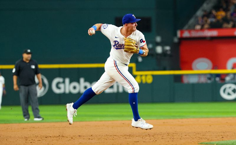 Aug 20, 2024; Arlington, Texas, USA; Texas Rangers third baseman Josh Jung (6) makes a throw during the third inning against the Pittsburgh Pirates  at Globe Life Field. Mandatory Credit: Kevin Jairaj-USA TODAY Sports
