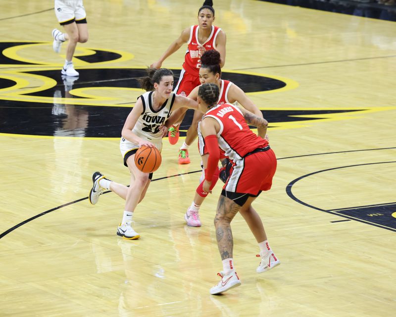 Mar 3, 2024; Iowa City, Iowa, USA; Iowa Hawkeyes guard Caitlin Clark (22) looks for free space against the Ohio State Buckeyes during the first half at Carver-Hawkeye Arena. Mandatory Credit: Reese Strickland-USA TODAY Sports