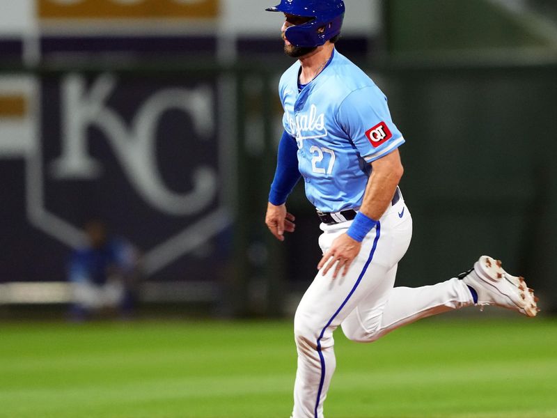 Mar 5, 2024; Surprise, Arizona, USA; Kansas City Royals right fielder Tyler Gentry (27) runs to third base against the Chicago Cubs during the third inning at Surprise Stadium. Mandatory Credit: Joe Camporeale-USA TODAY Sports