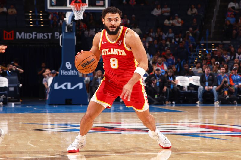 OKLAHOMA CITY, OK - OCTOBER 17: David Roddy #8 of the Atlanta Hawks dribbles the ball during the game against the Oklahoma City Thunder on October 17, 2024 at Paycom Arena in Oklahoma City, Oklahoma. NOTE TO USER: User expressly acknowledges and agrees that, by downloading and or using this photograph, User is consenting to the terms and conditions of the Getty Images License Agreement. Mandatory Copyright Notice: Copyright 2024 NBAE (Photo by Zach Beeker/NBAE via Getty Images)