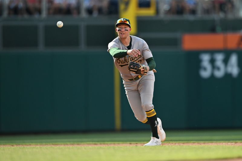 Jul 13, 2024; Philadelphia, Pennsylvania, USA; Oakland Athletics third baseman Brett Harris (77) throws to first against the Philadelphia Phillies in the sixth inning at Citizens Bank Park. Mandatory Credit: Kyle Ross-USA TODAY Sports