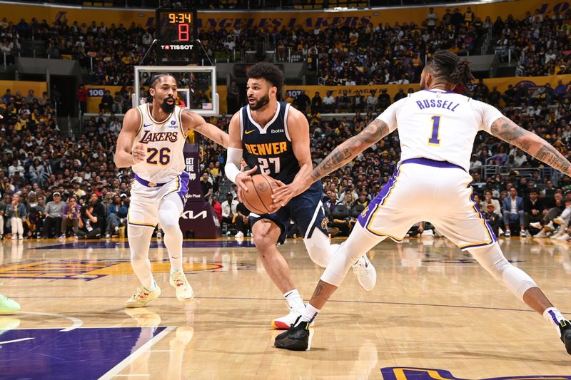 LOS ANGELES, CA - APRIL 27: Jamal Murray #27 of the Denver Nuggets drives to the basket during the game against the Los Angeles Lakers during Round 1 Game 4 of the 2024 NBA Playoffs on April 27, 2024 at Crypto.Com Arena in Los Angeles, California. NOTE TO USER: User expressly acknowledges and agrees that, by downloading and/or using this Photograph, user is consenting to the terms and conditions of the Getty Images License Agreement. Mandatory Copyright Notice: Copyright 2024 NBAE (Photo by Andrew D. Bernstein/NBAE via Getty Images)